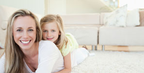 Mother and daughter lying on the floor